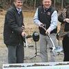 City Manager Fred Ramey, left, and Big Stone Gap Town Manager Steve Lawson break ground for the High Knob Destination Center.  KENNETH CROWSON PHOTO