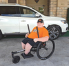 Ian Boggs demonstrates a Grit Freedom chair.  PROVIDED BY DEBBI HALE