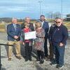Holding the sports complex check are Wise Mayor Teresa Adkins and Town Manager Laura Roberts. Behind them, left to right, are Virginia Energy official Randy Moore, Congressman Morgan Griffith, Virginia Energy official Daniel Kestner and town council members Ben Conway and Jeff Dotson.  LISA MAINE PHOTO