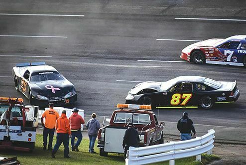 Jacob York (25) and Bryce Blake (87) got a little too close for comfort during the first Limited Late Model division race. PHOTO BY RJ ROSE