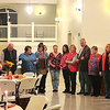 New Members of the Norton Lions Club formed a semi-circle with their sponsors during Monday evening’s induction ceremony at the Hotel Norton.