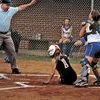 Holston's Megan Honaker (1) is called safe after she crossed the plate with the game-winning run as Coeburn catcher Catherine Nixon (right) looks on in disbelief after making the tag during the 18th inning Wednesday in the VHSL Group A state quarterfinals.Click Hereto order photo reprints
