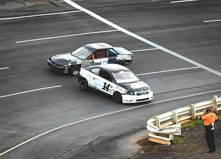 Josh Trinkle (14) spins out going through turn three and Tony Casteel (4C) is unable to avoid the crash. PHOTO BY RJ ROSE