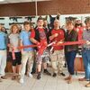 Norton officials, Chamber of Commerce officials and others gathered Oct. 1 to celebrate the opening of North 40 Airsoft in the city. The owners are Jack and Alma Flanary.  CHAMBER OF COMMERCE PHOTO