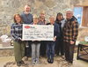 Left to right, Angela Sackett, Executive Director Brian Sackett, Wise Mayor Teresa Adkins, Office on Youth Executive Director Glenda Collins and volunteer staff Rob and Connie Albright display the $2,500 check.  LISA MAINE PHOTO