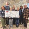 Left to right, Angela Sackett, Executive Director Brian Sackett, Wise Mayor Teresa Adkins, Office on Youth Executive Director Glenda Collins and volunteer staff Rob and Connie Albright display the $2,500 check.  LISA MAINE PHOTO