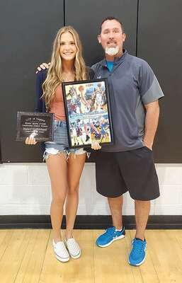 Overall winner Hailey Sutherland and head girls’ basketball coach Donnie Frazier. PHOTO BY KELLEY PEARSON