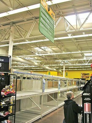 Monday afternoon, the shelves for toilet paper and other paper products were cleaned out at the Norton Walmart store, following a nationwide trend of panicked shopping by people who expect to lay low during the coronavirus outbreak.  JEFF LESTER PHOTO